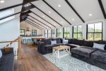 Sweeping views of the living room, dining room and kitchen